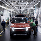 Rivian stock drops as full-year loss projection widens, but 'modest gross profit' still expected in Q4