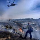 California faces more fire risk and strong winds but potential rain coming over the weekend