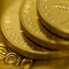 Gold Extends Losses as Dollar Pushes Higher on Japan Debt Plan