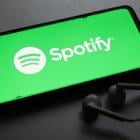 Spotify stock jumps after reporting its first full year of profitability, strong user metrics