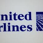 A sleeping United Airlines passenger was beaten bloody by fellow flyer