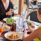 Americans, Planning on Dining out More, Turn to Savvy Money-Saving Strategies: Doggy Bags, Happy Hours and Value Meals Surge in Popularity