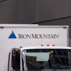 Here's How You Can Earn $100 In Passive Income By Investing In Iron Mountain Stock