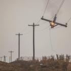 Power lines ignited the largest wildfire in Texas history and one nearby, officials say